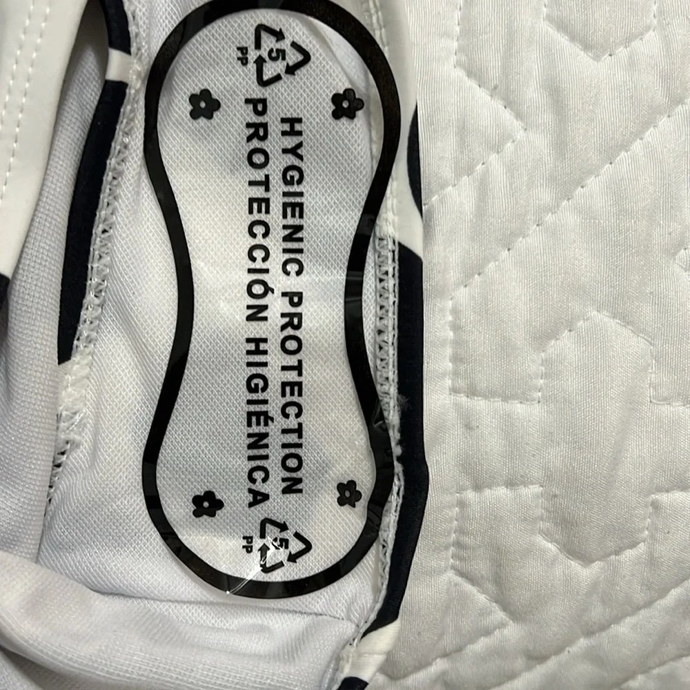 NWOT Black and white asymmetric swimsuit size L.